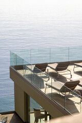 Terrace with bathing buns facing Mediterranean sea  in Camogli, a fishing village and resort close to the peninsula of Portofino, in the Riviera di Levante, Genoa Liguria Italy