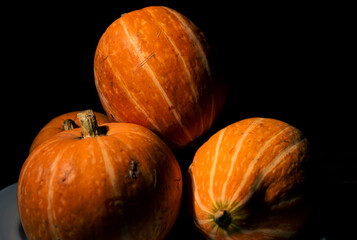 Pumpkins on a black background.