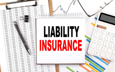LIABILITY INSURANCE text on notebook with chart, calculator and pen