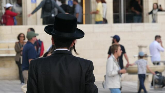 Orthodox Jew walking down the street