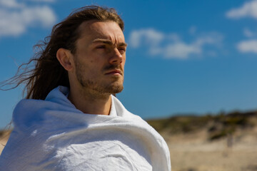 Portrait of a man who looks like Jesus Christ in desert