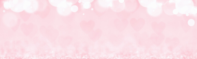 St Valentines day pink background top border wide banner. Many hearts f Love or wedding concept with bokeh lights