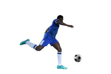 Football striker with blue team suit chases the soccerball