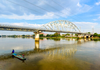 A man is fishing near the old Binh Loi bridge in Ho Chi Minh City, Vietnam. This is the first...