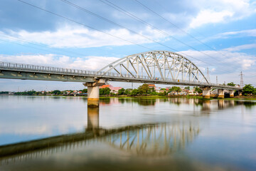 Landscape of Binh Loi bridge in Ho Chi Minh City., Vietnam. This is the first railway bridge across the Saigon River, started construction in 1898 and completed in 1902 by French engineers. - obrazy, fototapety, plakaty