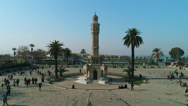 drone view of izmir clock tower and people in the square