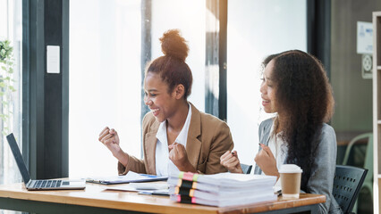 An African American businesswoman participates in a staff meeting and working together at workplace.