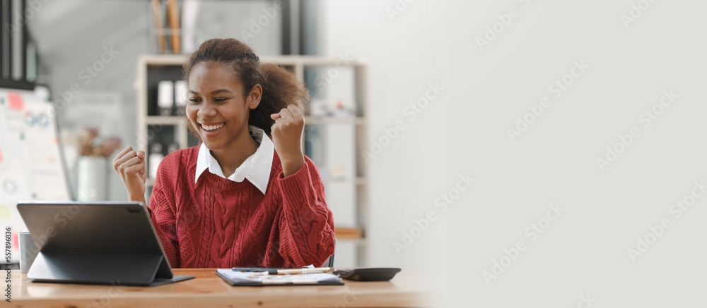 Wall mural smiling african american hispanic student looking up from laptop at campus library, using tablet and