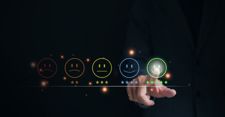 Customer review satisfaction feedback survey concept. Businessman pressing smiley face emoticon on...