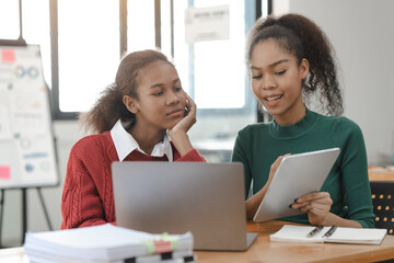 African American girls students studying up for test or making homework together, Back to school concept.