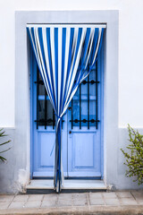Fototapeta premium Blue and white Striped curtain on door