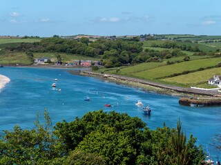 Many small boats are anchored in Clonakilty Bay on a sunny spring day. Seascape of the south of...