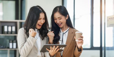 Asian company employees and colleagues work together in the office. by talking and giving advice to each other