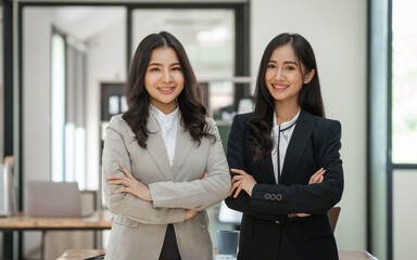 Asian company employees and colleagues work together in the office. by talking and giving advice to each other