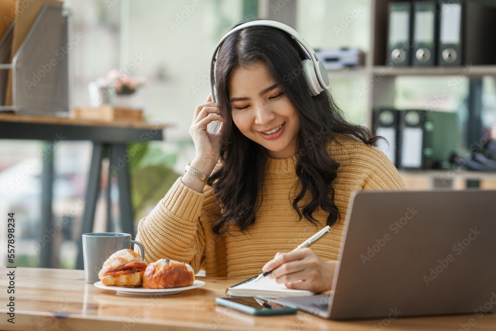 Wall mural asian teenager college student woman learning online on laptop with happiness smile and positive thi