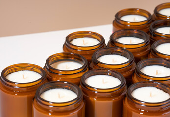 A set of different aroma Soy wax candles in brown glass jars. Scented calming candle. Natural...