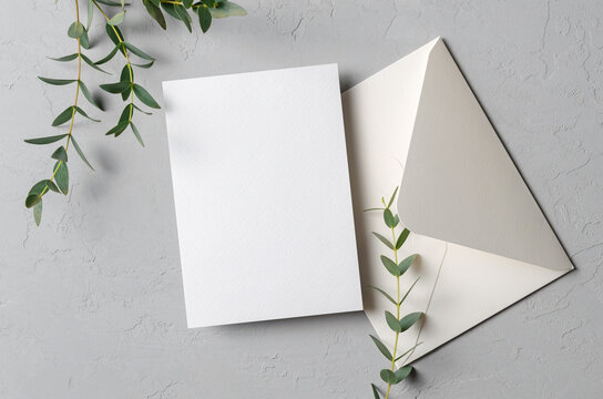 Save the date card mockup with envelope and eucalyptus twigs
