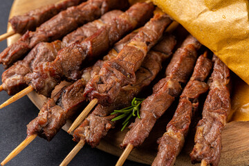 Lamb skewers or kebabs cooked on a brazier, with rosemary and spices.  Arrosticini, italian dish.