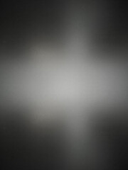 Frosted gray glass texture. Dark shadow from behind.