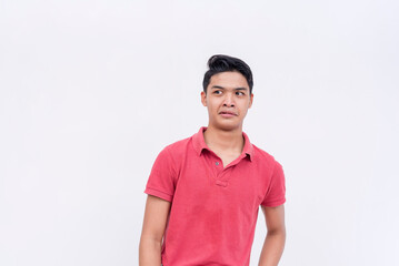 A young man squirms in disgust, reacting to a cringey joke. Isolated on a white background.