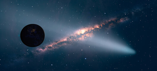 Comet on the space Milky Way galaxy in the background 