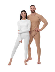 Man and woman in warm thermal underwear on white background
