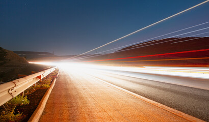 Obraz premium Long exposure photo of traffic on the move 