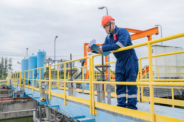 Water plant maintenance technicians, mechanical engineers check the control system at the water treatment plant.