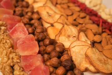 Mix of delicious dried nuts and fruits, closeup