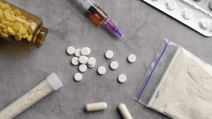 Many different hard drugs on light grey table, flat lay