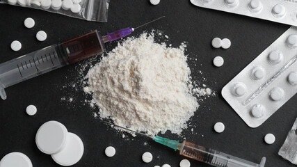 Many different hard drugs on black background, flat lay