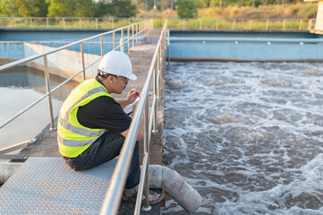 Environmental engineers work at wastewater treatment plants,Water supply engineering working at Water recycling plant for reuse