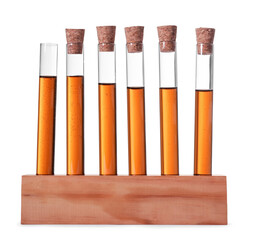 Test tubes with brown liquid in stand on white background