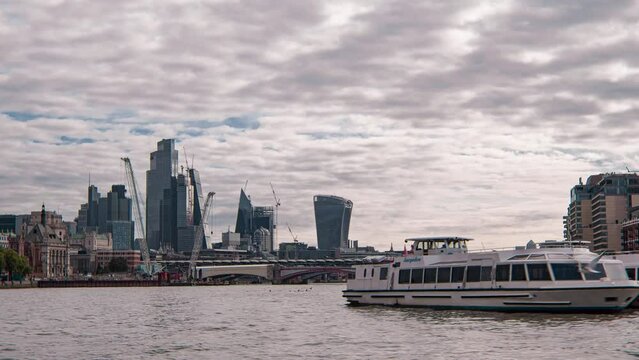 Cinematic moving shot of City of London Skyline and Thames River England, United Kingdom on a beautiful sunny day