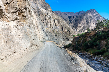 a road in the mountains carved in the rock