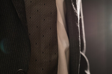 Dark gray suit and tie on the businessman.
