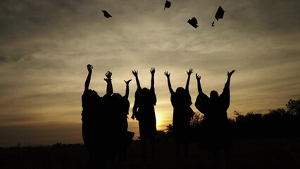 abstract Close up Rear view group of the university graduates at Silhouette sunset