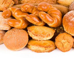 Croissants and sweet pastries isolated on white. Free space for text.