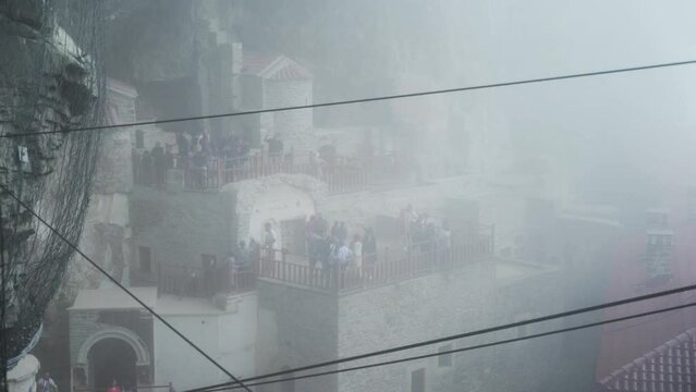Zoom out sumela monastery in foggy weather, Sumela Monastery among the clouds of fog
