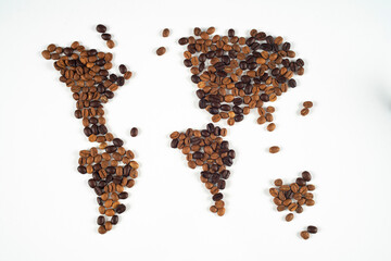 Coffee beans forming a world map on a white background.