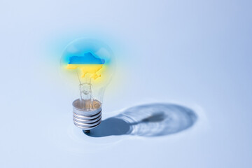 The glass bulb lamp with a yellow-blue Ukrainian map glow inside. Strong concept of Ukrainians