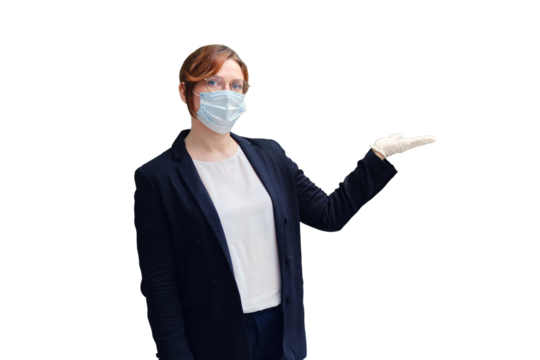 A teacher stands at the blackboard after a coronavirus pandemic in a medical mask, copy space for text, isolated on a white background. School quarantine concept during flu virus epidemic.epidemic