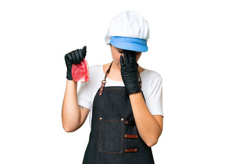 Butcher woman wearing an apron and serving fresh cut meat over isolated chroma key background with tired and sick expression