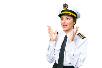 Airplane pilot woman over isolated chroma key background with surprise facial expression