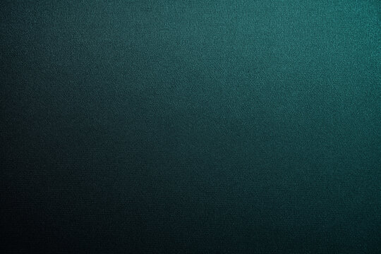 Black blue green abstract background. Gradient. Petrol color. Dark matte background with space for design. Toned fabric surface. Template. Empty.