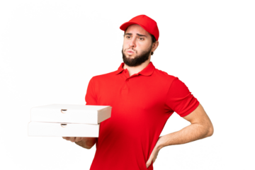 pizza delivery man with work uniform picking up pizza boxes over isolated chroma key background suffering from backache for having made an effort