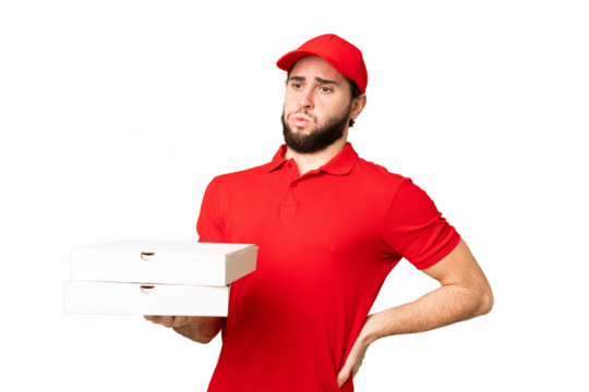 pizza delivery man with work uniform picking up pizza boxes over isolated chroma key background suffering from backache for having made an effort - Powered by Adobe