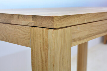 Wooden table corner background, natural wood furniture close view