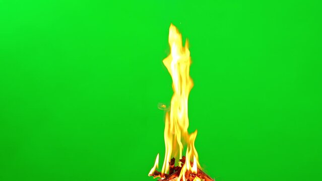 Slow motion fire flame glowing on green screen background