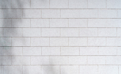 White tile background. Wall with white tiles for the interior of the kitchen or bathroom in the house. Decor, design and decoration of kitchen and bathroom interiors